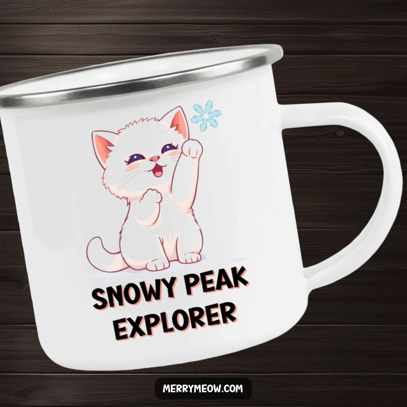 Funny camping mug with a white kitten batting at a snowflake, perfect for winter outdoor activities.