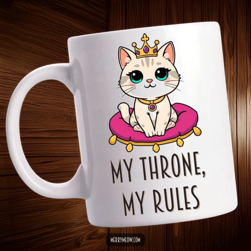Funny Mug: A regal cat wearing a tiny crown sits majestically on a velvet cushion, exuding hilarious, aristocratic charm.