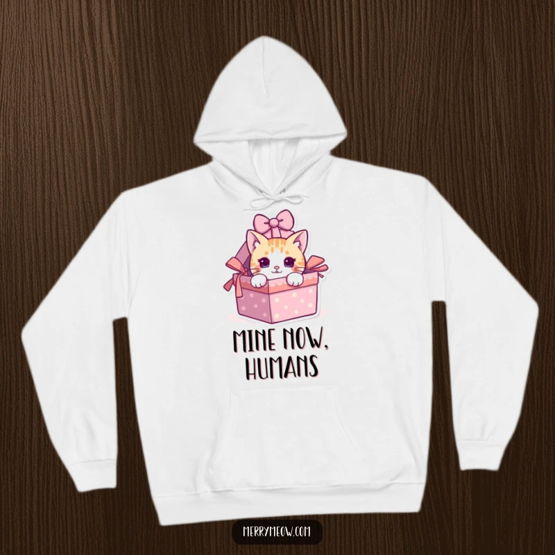 Funny cat peeking from a gift box, featured on a comfortable hoodie, ideal for cozy humor.