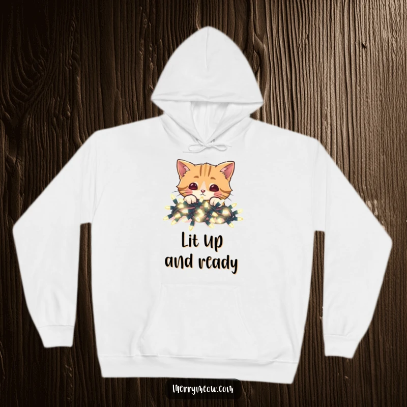 Funny hoodie showcasing a cat peeking over vibrant, glowing Christmas lights, providing warmth and holiday cheer.
