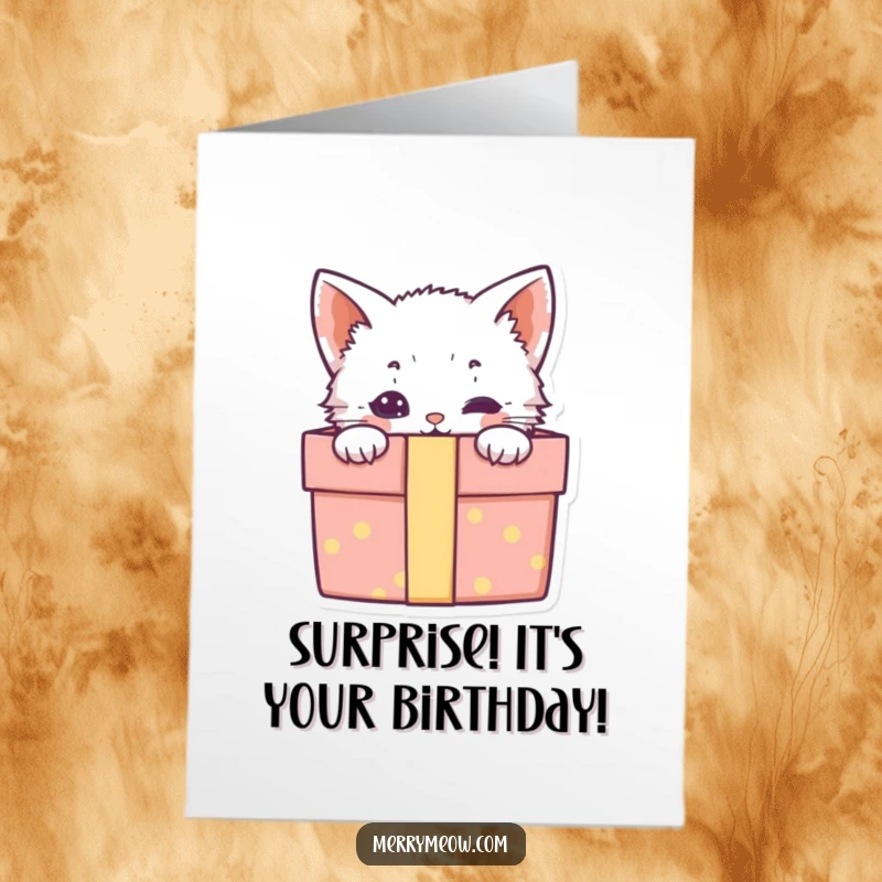 Free Printable Kitten Birthday Card: A cute kitten peeks out from a gift box, ready to celebrate your birthday.