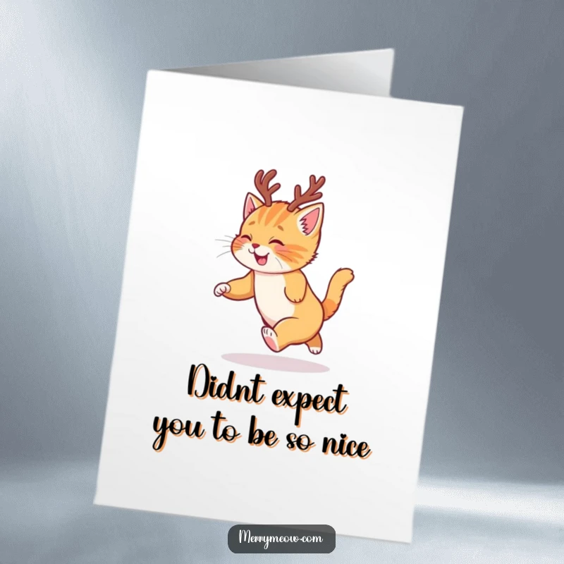Funny Free Printable Thank You Card: A ginger kitten in reindeer antlers is captured mid-spin chasing its tail gleefully.