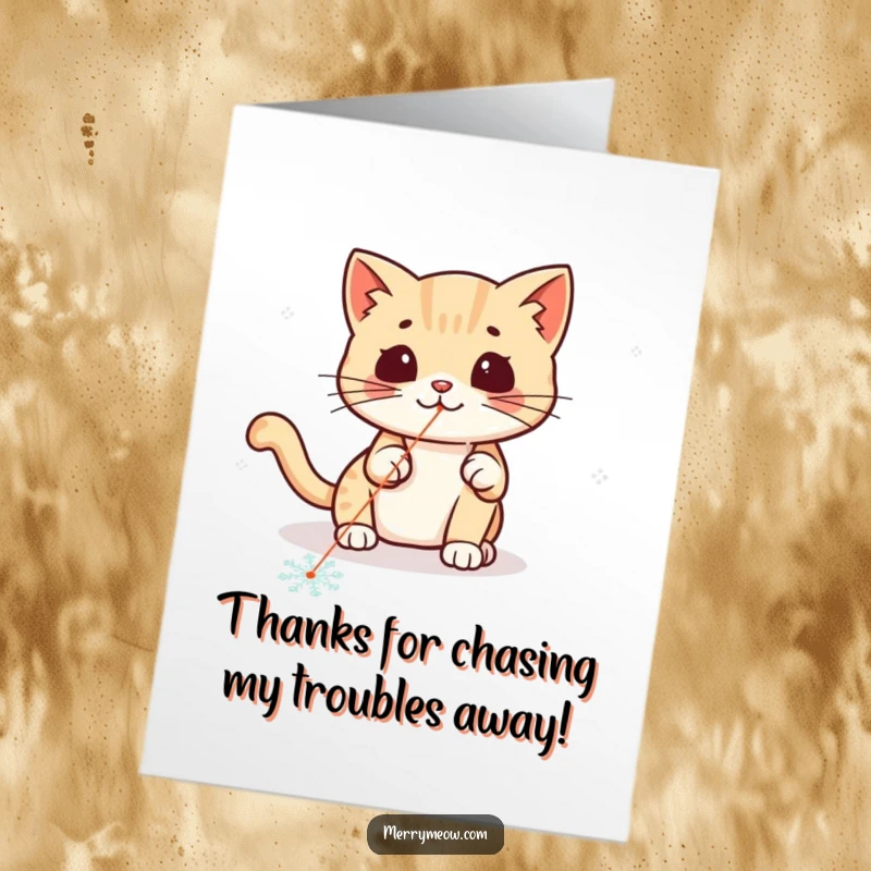 Funny Free Printable Kawaii Cat Thank You Card, a cute cat hilariously chasing a laser pointer dot on a snowflake.