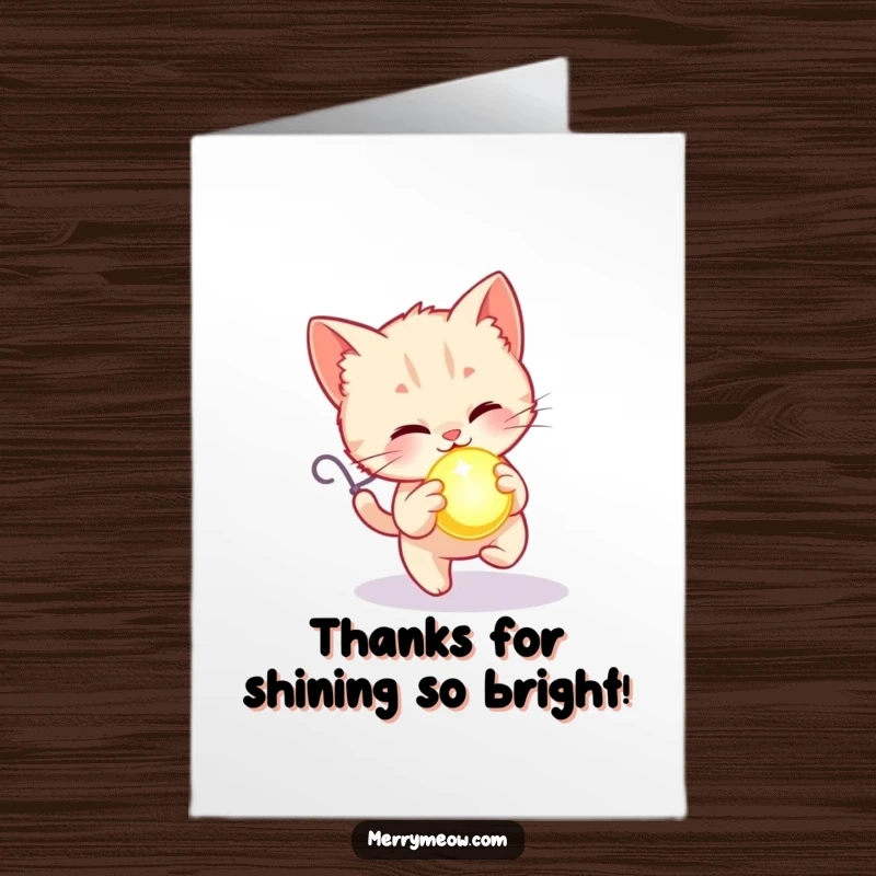 Free Printable Kitten Thank You Card: A happy kitten chases a glowing ornament, sending a thankful hello.