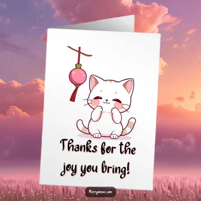 Funny Free Printable Thank You Card: A cute cat clumsily batting at a dangling ornament, saying thanks with a wiggle.