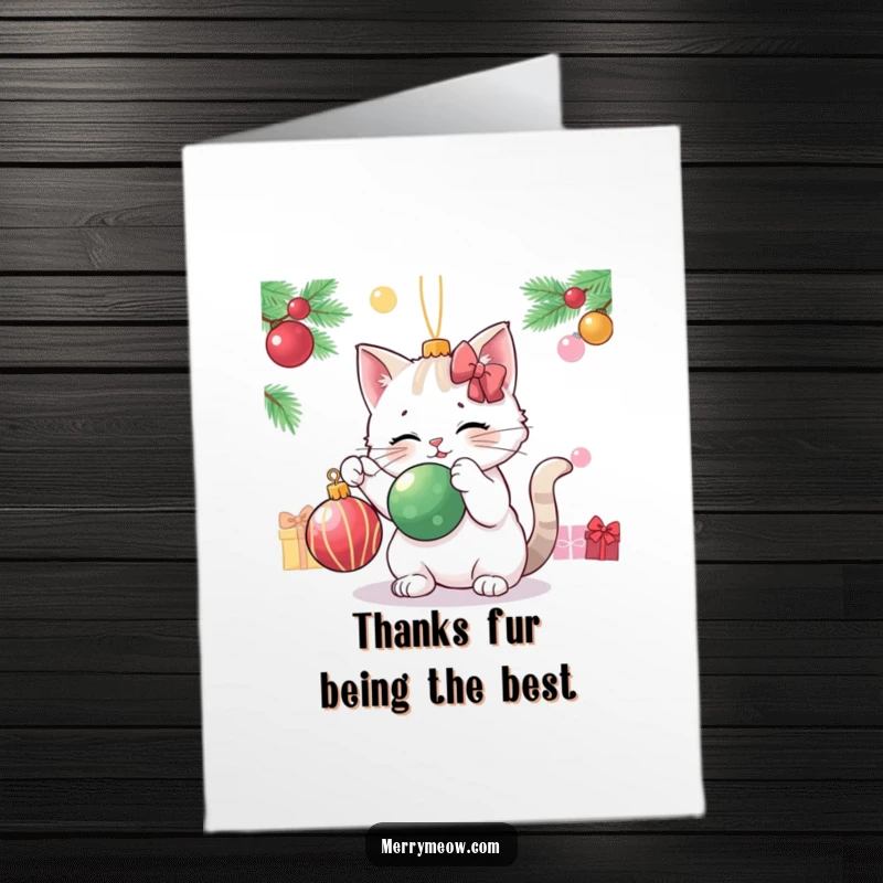 Funny Free Printable Thank You Card: A cat character playfully bats at a Christmas ornament, offering thanks.
