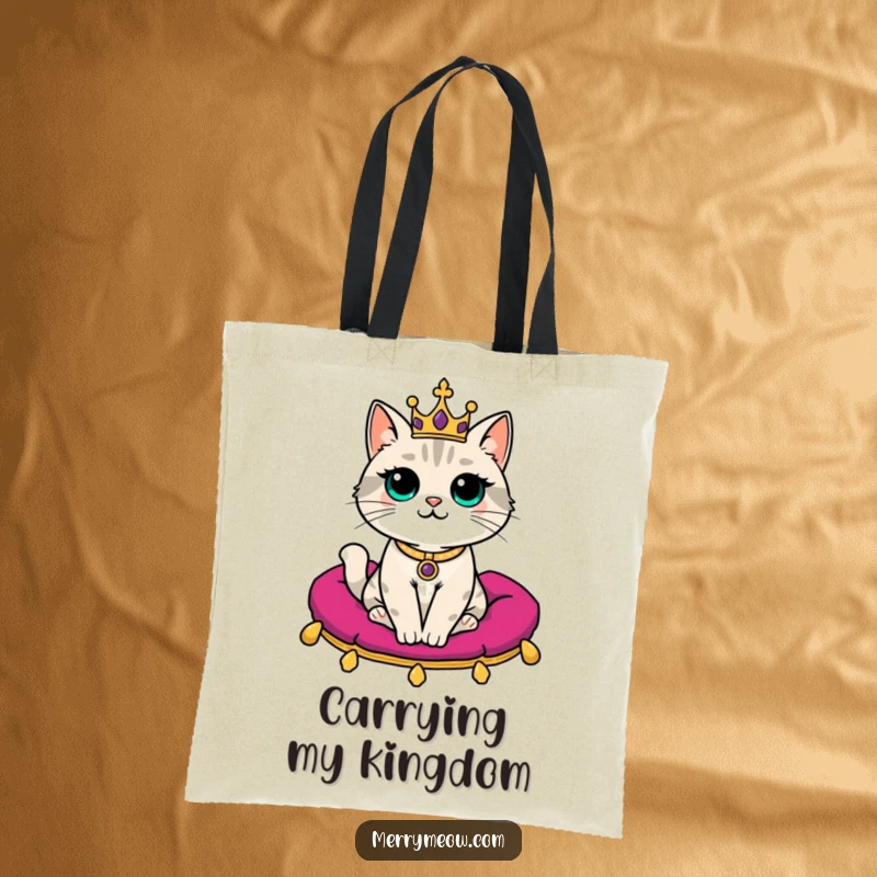 Funny Tote Bag: A dignified cat with a tiny crown sits regally on a velvet cushion, ready for royal errands.