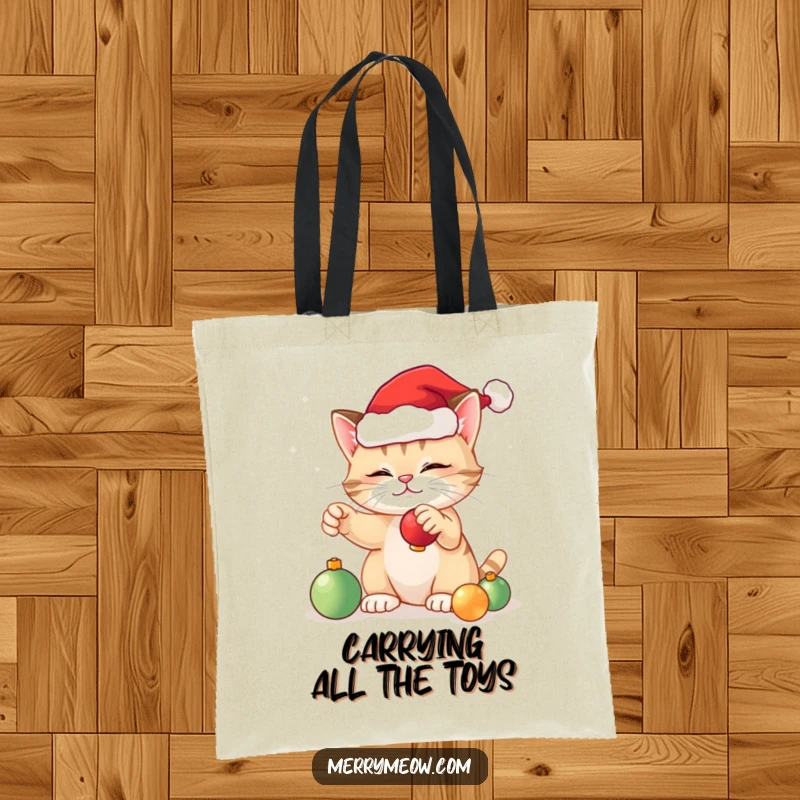 Funny festive cat tote bag showing a cute cat with a Santa hat batting at shiny Christmas ornaments, perfect for holiday errands.