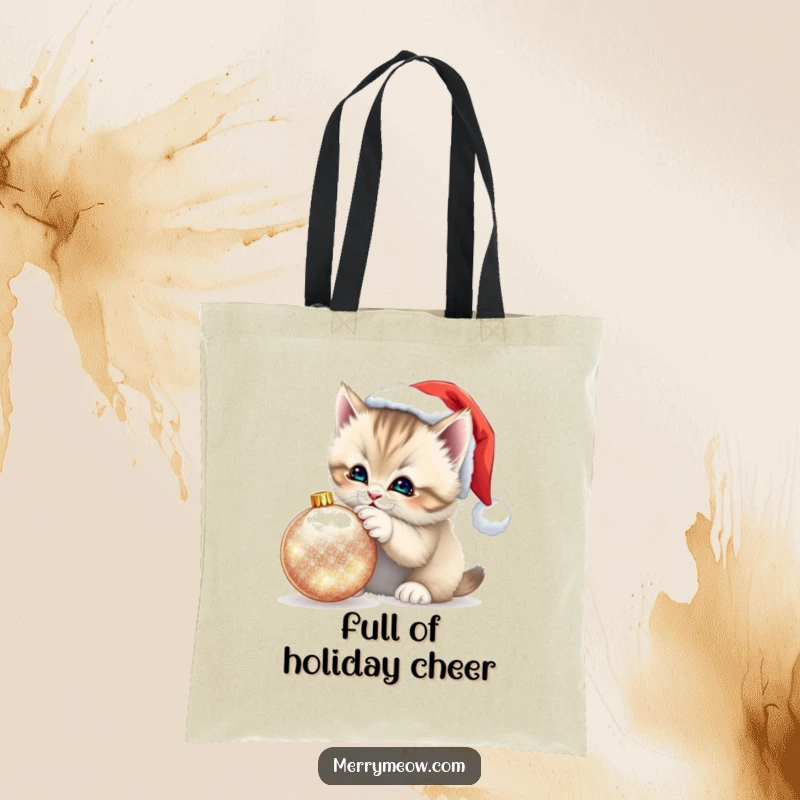 Funny Kitten Santa Hat Tote Bag: Festive tote featuring a fluffy kitten in a Santa hat playfully batting at a shimmering ornament, great for gifts.